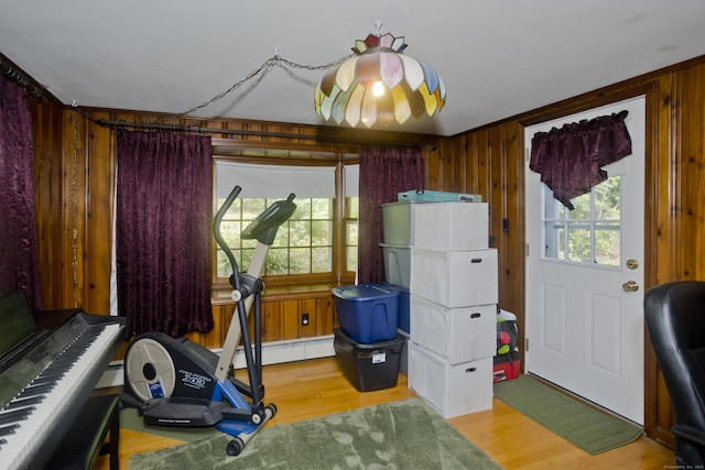 42 Sycamore Ter, Windham, CT 06280 - workout room with a baseboard heating unit, light wood-type flooring, plenty of natural light, and wood walls