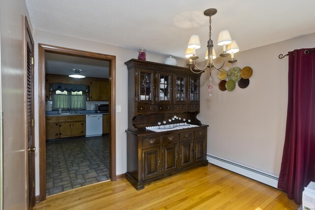 42 Sycamore Ter, Windham, CT 06280 - bar with a baseboard heating unit, dishwasher, a chandelier, and stainless steel microwave