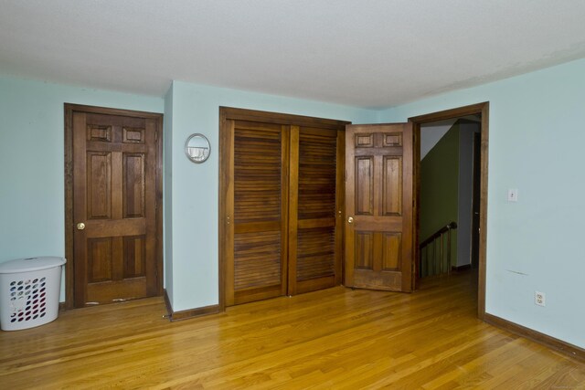 42 Sycamore Ter, Windham, CT 06280 - bedroom featuring a closet and light wood-style floors