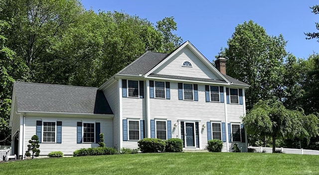 59 Woodbine Rd, Colchester, CT 06415 - view of front facade featuring a front lawn and a chimney
