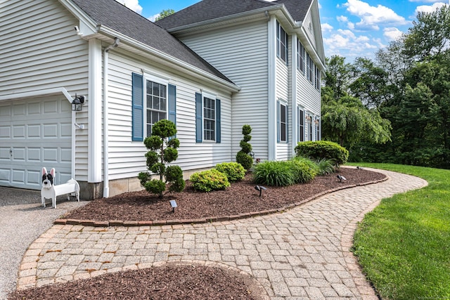 59 Woodbine Rd, Colchester, CT 06415 - view of side of property with driveway and a shingled roof