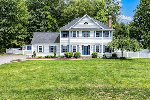 59 Woodbine Rd, Colchester, CT 06415 - colonial-style house featuring a chimney and roof with shingles