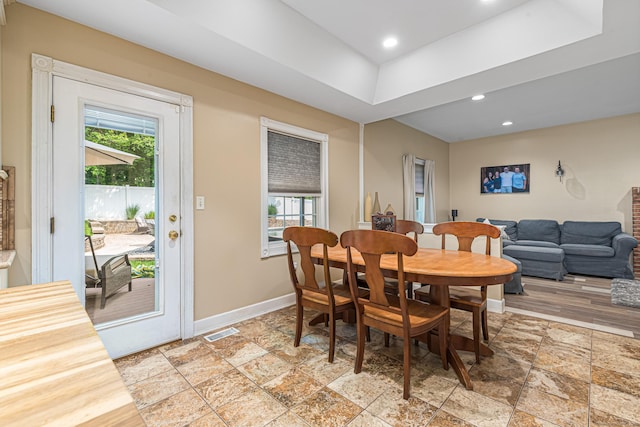 59 Woodbine Rd, Colchester, CT 06415 - dining space with baseboards, stone tile floors, a raised ceiling, and recessed lighting