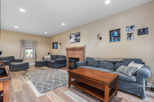 59 Woodbine Rd, Colchester, CT 06415 - living room with light wood-style flooring, recessed lighting, and a brick fireplace