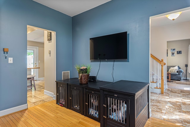 59 Woodbine Rd, Colchester, CT 06415 - corridor featuring stairway, hardwood / wood-style floors, baseboards, and a desk