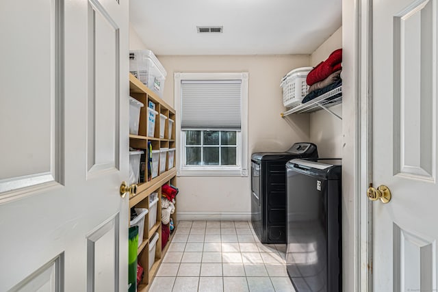 59 Woodbine Rd, Colchester, CT 06415 - laundry area with separate washer and dryer, light tile patterned floors, and baseboards