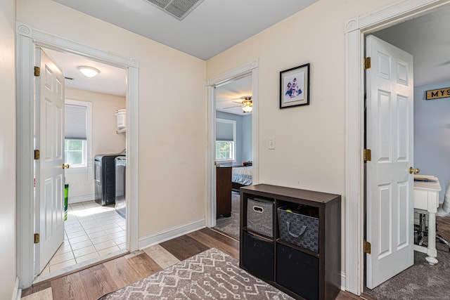 59 Woodbine Rd, Colchester, CT 06415 - corridor with wood finished floors, healthy amount of natural light, and baseboards