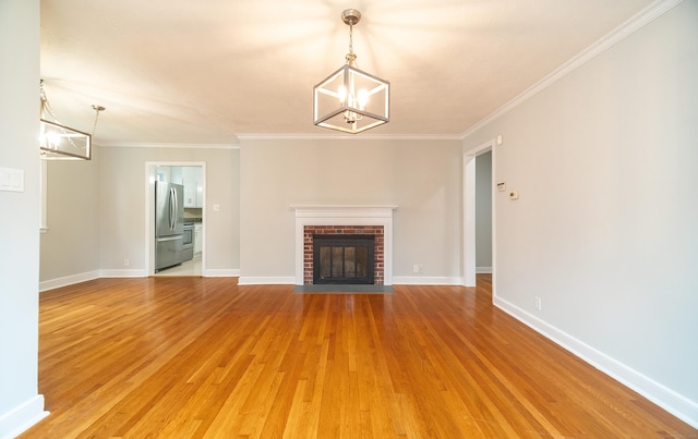 43 Breyer Ave, Bridgeport, CT 06606 - unfurnished living room featuring a chandelier, light wood finished floors, baseboards, a fireplace, and crown molding