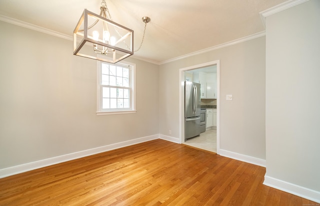 43 Breyer Ave, Bridgeport, CT 06606 - unfurnished room featuring a chandelier, light wood finished floors, baseboards, and ornamental molding