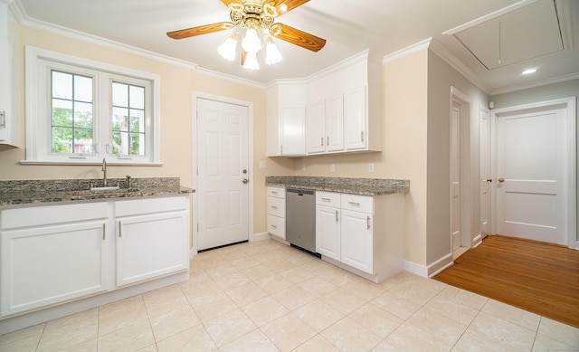43 Breyer Ave, Bridgeport, CT 06606 - kitchen with a sink, crown molding, baseboards, light tile patterned flooring, and white cabinets