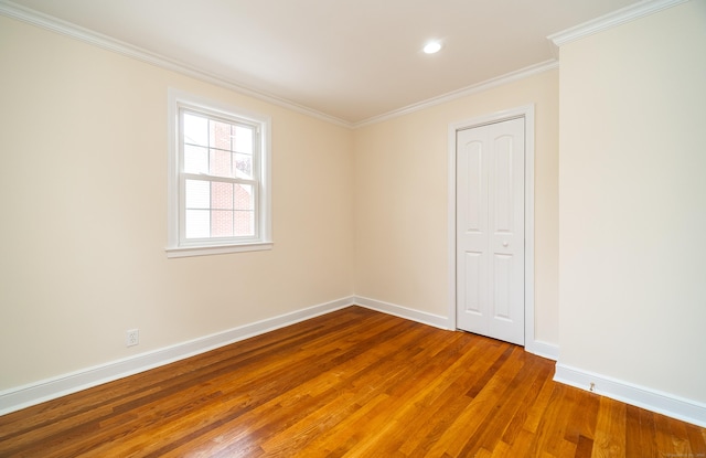43 Breyer Ave, Bridgeport, CT 06606 - spare room with wood finished floors, baseboards, ornamental molding, and recessed lighting