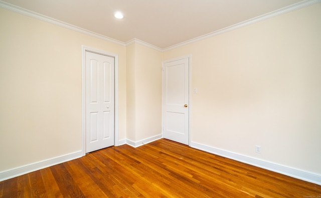 43 Breyer Ave, Bridgeport, CT 06606 - empty room featuring wood finished floors, baseboards, ornamental molding, and recessed lighting