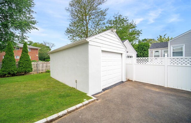 43 Breyer Ave, Bridgeport, CT 06606 - detached garage featuring asphalt driveway