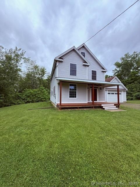 15 Suffield St, Windsor Locks, CT 06096 - view of front facade with covered porch and a front yard
