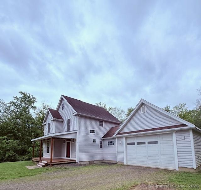 15 Suffield St, Windsor Locks, CT 06096 - view of side of home featuring a porch and a yard