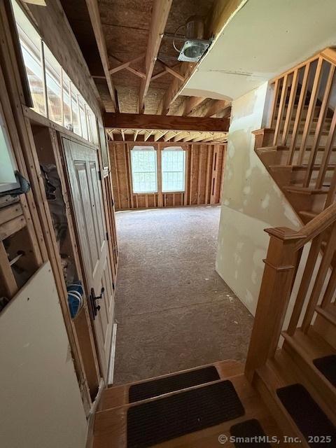 15 Suffield St, Windsor Locks, CT 06096 - misc room with carpet and stairs
