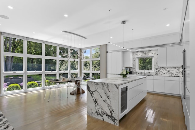 326 Georgetown Rd, Weston, CT 06883 - kitchen featuring modern cabinets, beverage cooler, healthy amount of natural light, white cabinets, and recessed lighting