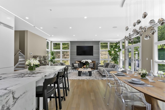 326 Georgetown Rd, Weston, CT 06883 - dining room with light wood-type flooring, recessed lighting, stairway, and a large fireplace