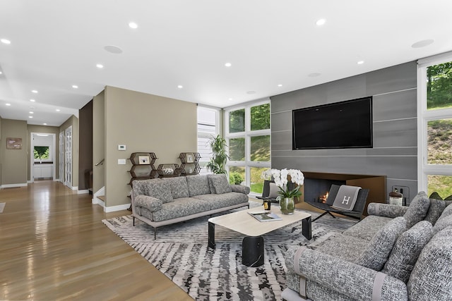 326 Georgetown Rd, Weston, CT 06883 - living area with wood finished floors, recessed lighting, baseboards, and stairway