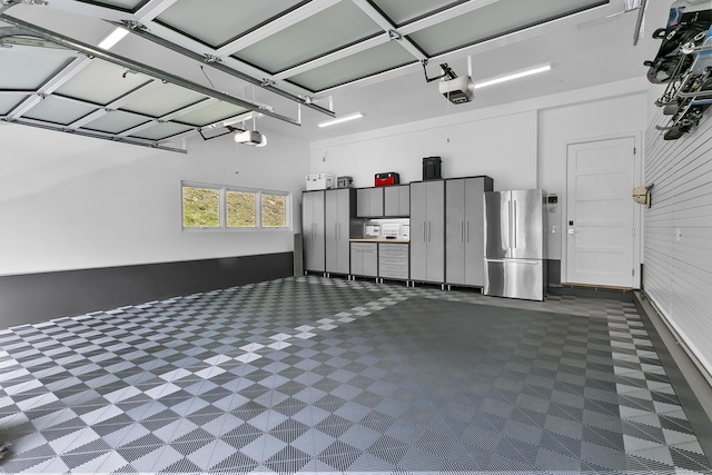 326 Georgetown Rd, Weston, CT 06883 - garage with freestanding refrigerator and a garage door opener