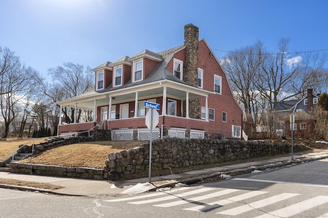 209 Pequot Ave, New London, CT 06320 - view of front facade with covered porch, a chimney, a shingled roof, and a gambrel roof