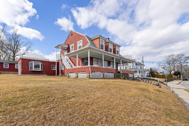 209 Pequot Ave, New London, CT 06320 - view of front of home with covered porch, a front lawn, and a gambrel roof