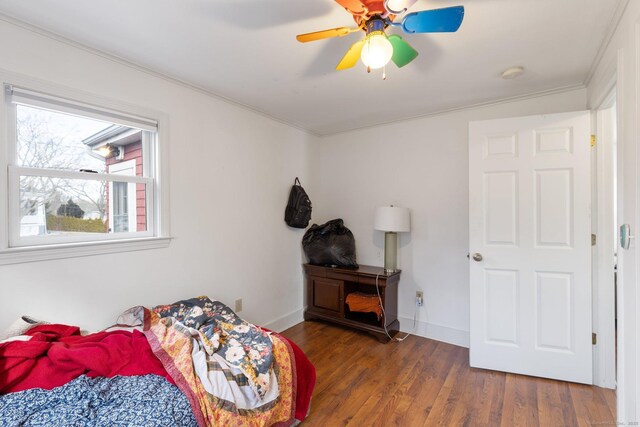 209 Pequot Ave, New London, CT 06320 - bedroom with crown molding, wood finished floors, a ceiling fan, and baseboards