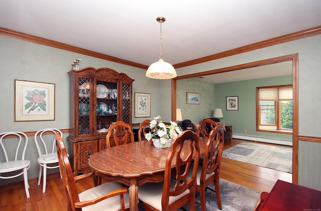 43 Redwood Cir, Shelton, CT 06484 - dining area with baseboard heating, wood finished floors, and crown molding