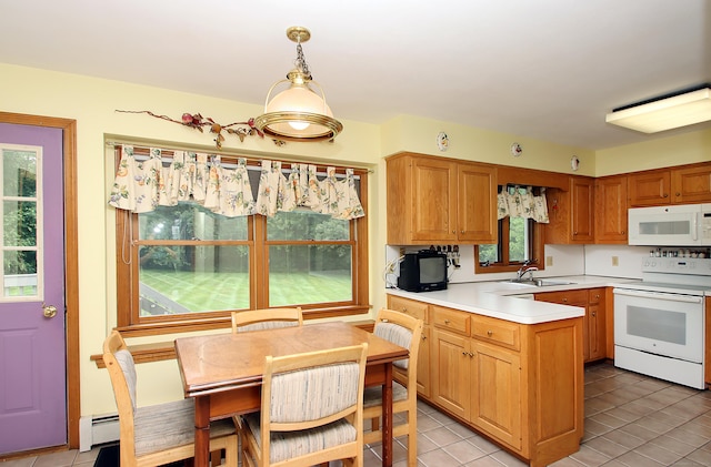 43 Redwood Cir, Shelton, CT 06484 - kitchen with white appliances, a peninsula, light countertops, a baseboard radiator, and light tile patterned floors