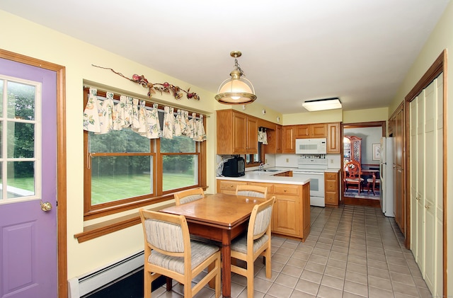 43 Redwood Cir, Shelton, CT 06484 - kitchen with white appliances, baseboard heating, a peninsula, light countertops, and plenty of natural light