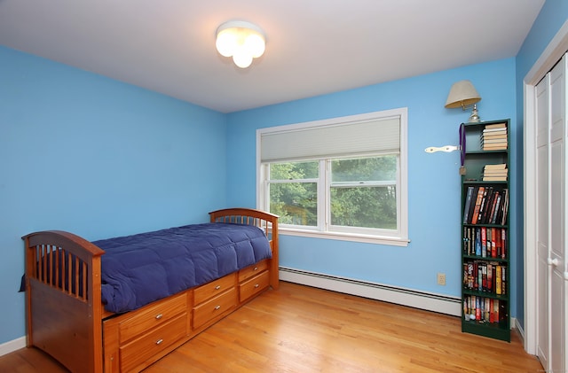 43 Redwood Cir, Shelton, CT 06484 - bedroom with baseboard heating and wood finished floors