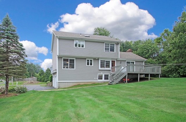 43 Redwood Cir, Shelton, CT 06484 - back of house with stairs, a deck, a lawn, asphalt driveway, and a chimney