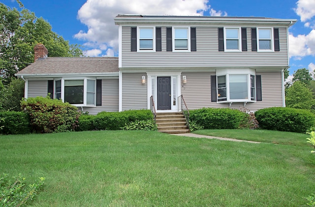 43 Redwood Cir, Shelton, CT 06484 - colonial home with a front yard and a chimney