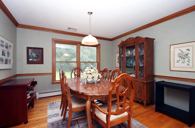 43 Redwood Cir, Shelton, CT 06484 - dining room featuring a baseboard heating unit, light wood finished floors, ornamental molding, and a wainscoted wall