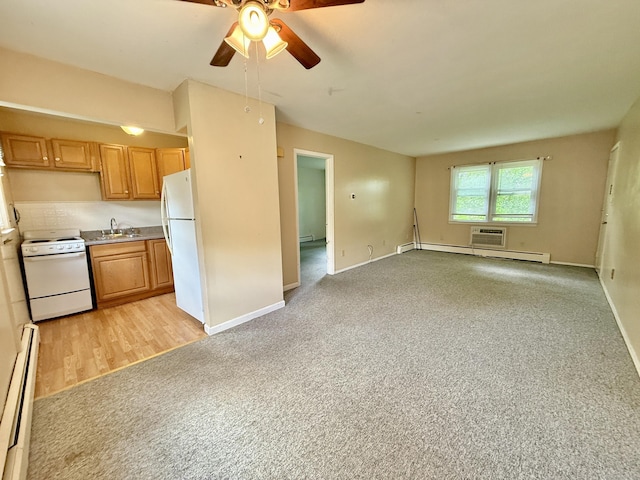 14 Arrowhead Way Apt C6, Woodbury, CT 06798 - kitchen featuring white appliances, baseboard heating, ceiling fan, a baseboard radiator, and baseboards