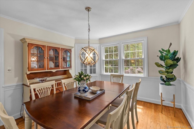 18 Hillcrest Rd, Manchester, CT 06040 - dining area featuring a chandelier, ornamental molding, light wood-style flooring, and wainscoting