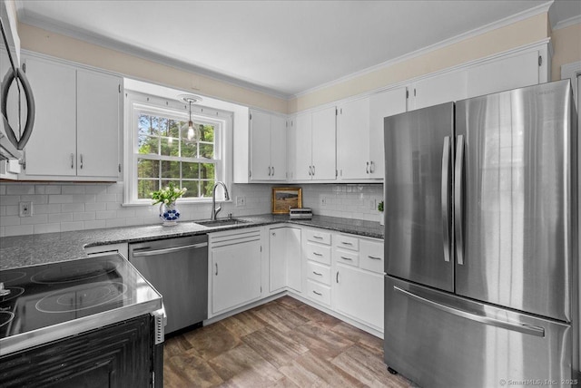 18 Hillcrest Rd, Manchester, CT 06040 - kitchen with appliances with stainless steel finishes, ornamental molding, a sink, tasteful backsplash, and white cabinets
