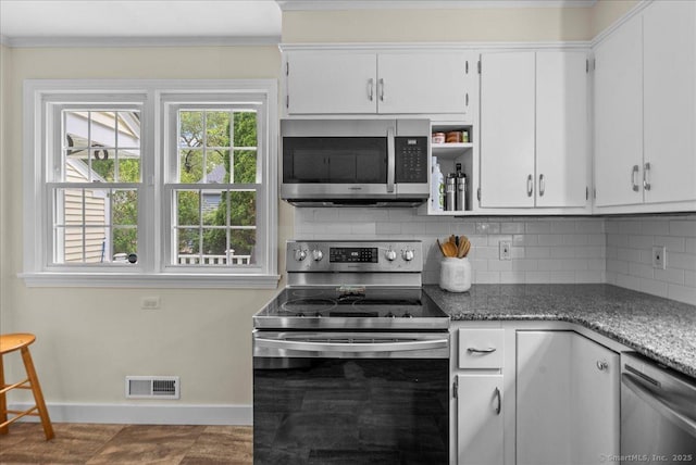 18 Hillcrest Rd, Manchester, CT 06040 - kitchen featuring stainless steel appliances, backsplash, baseboards, white cabinetry, and crown molding