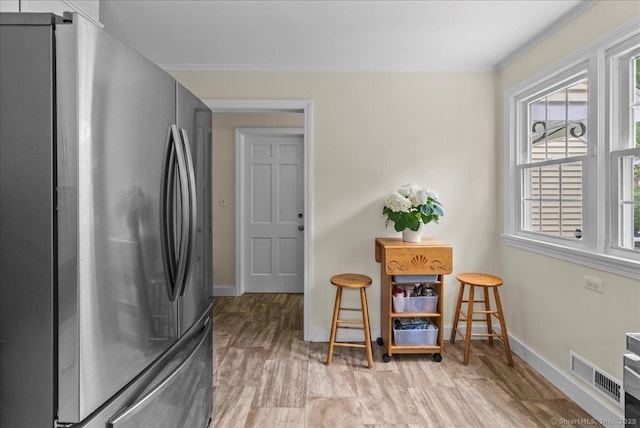 18 Hillcrest Rd, Manchester, CT 06040 - laundry room with baseboards, crown molding, and wood finished floors