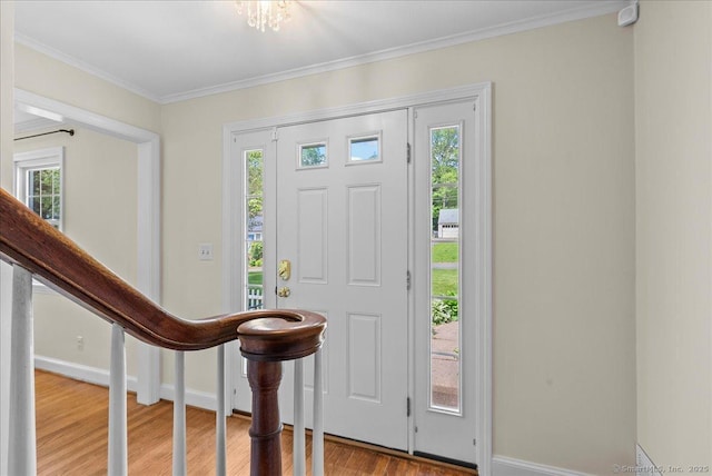 18 Hillcrest Rd, Manchester, CT 06040 - entrance foyer featuring baseboards, wood finished floors, crown molding, and stairs