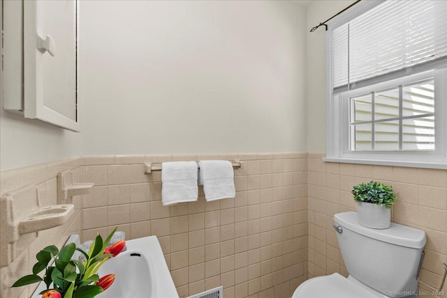 18 Hillcrest Rd, Manchester, CT 06040 - half bathroom featuring toilet, wainscoting, and tile walls
