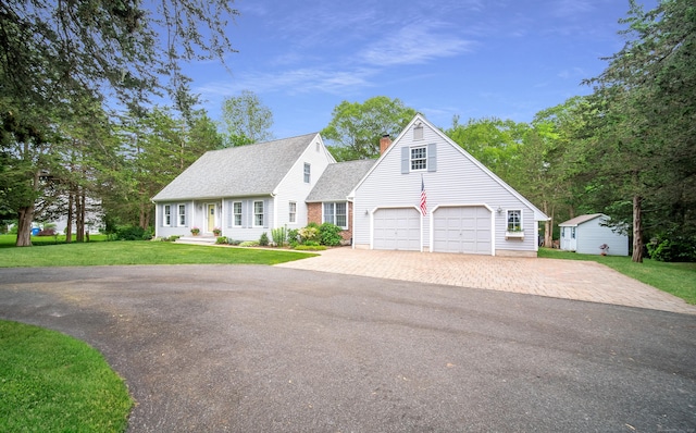 258 New Cheshire Rd, Wallingford, CT 06492 - cape cod house with asphalt driveway, roof with shingles, a chimney, and a front yard