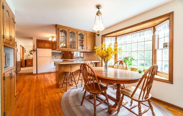 258 New Cheshire Rd, Wallingford, CT 06492 - dining space featuring light wood-style flooring and baseboards