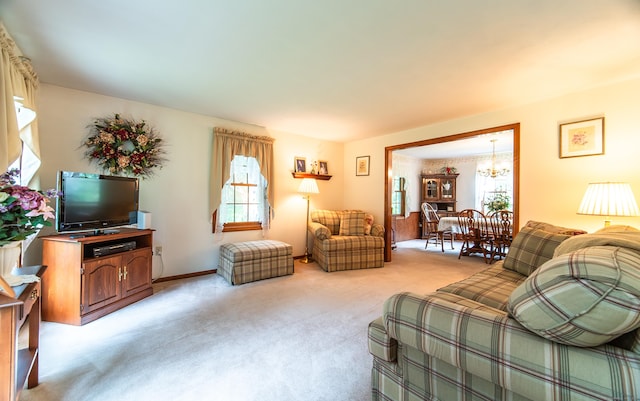 258 New Cheshire Rd, Wallingford, CT 06492 - living area featuring a chandelier, healthy amount of natural light, and light carpet