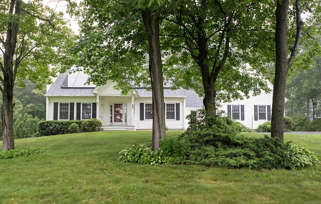 44 Richard Ave, Wolcott, CT 06716 - view of front of home with a front lawn and solar panels