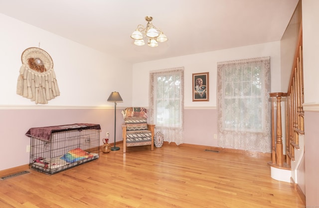44 Richard Ave, Wolcott, CT 06716 - sitting room featuring wood finished floors, a chandelier, and stairs