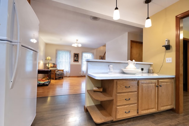 44 Richard Ave, Wolcott, CT 06716 - kitchen with freestanding refrigerator, dark wood-type flooring, light countertops, hanging light fixtures, and open shelves