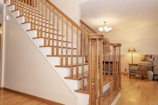44 Richard Ave, Wolcott, CT 06716 - staircase featuring wood finished floors and a chandelier