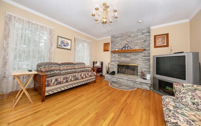 44 Richard Ave, Wolcott, CT 06716 - living area with wood finished floors, ornamental molding, a fireplace, and a chandelier