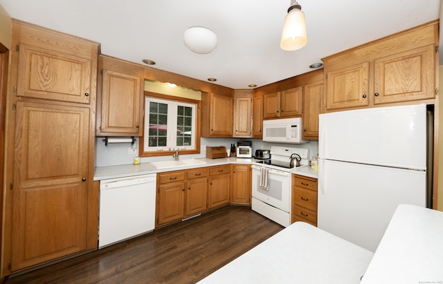 44 Richard Ave, Wolcott, CT 06716 - kitchen with white appliances, light countertops, dark wood-type flooring, and decorative light fixtures